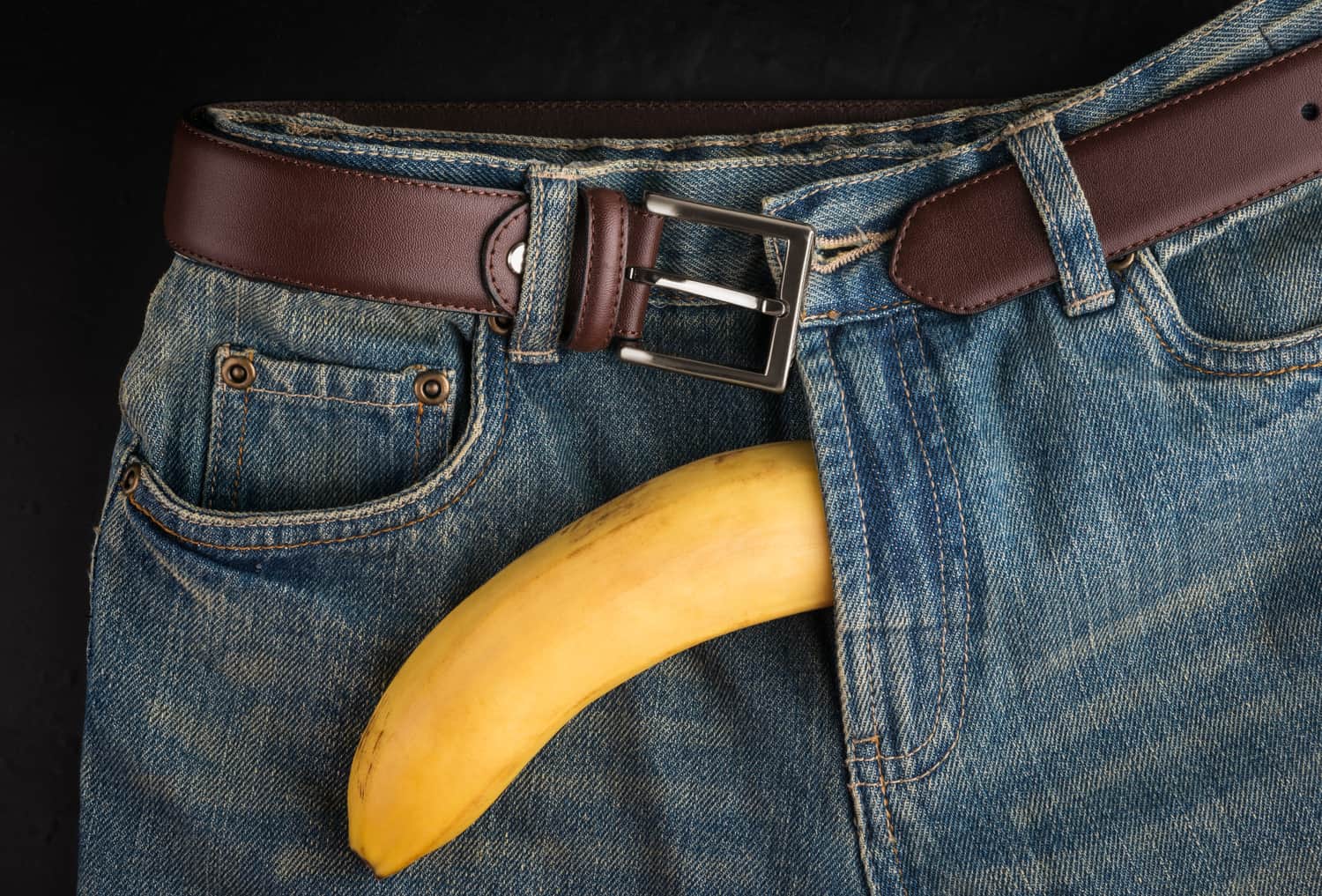 a banana is coming out of pants